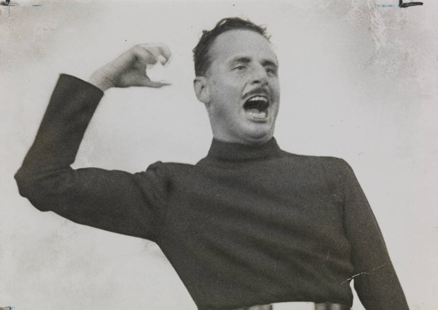 Mosley Speaking With His Arm Raised