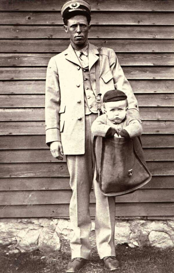 Weird Historical Photo Of A Mailman Delivering A Child