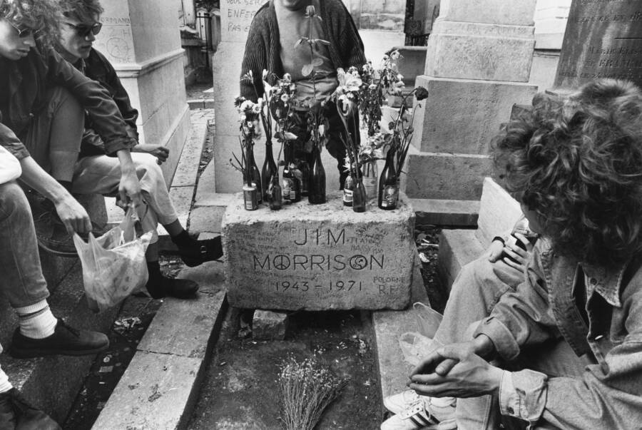 Ray Manzarek stands in front of the grave of Jim Morrison, surrounded  News Photo - Getty Images