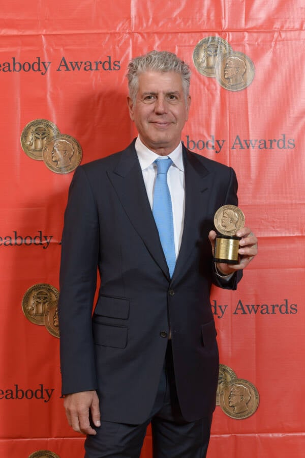 Anthony Bourdain Holding Peabody Award