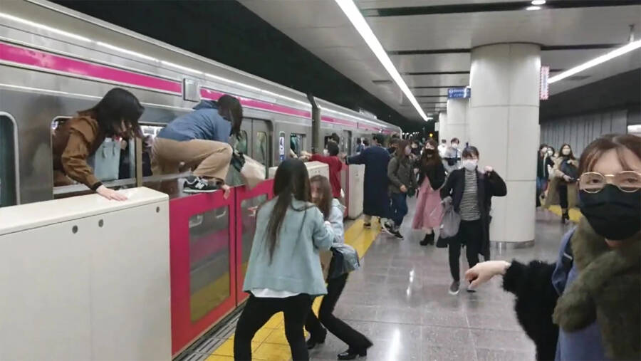 Passengers Climbing From Tokyo Train