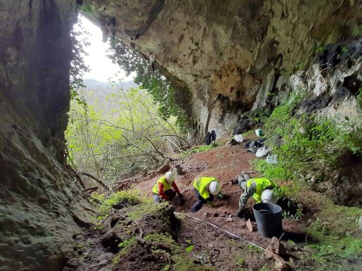 Archeologists Digging In Cave