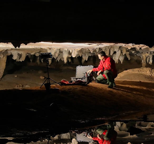 Photographer In Cave