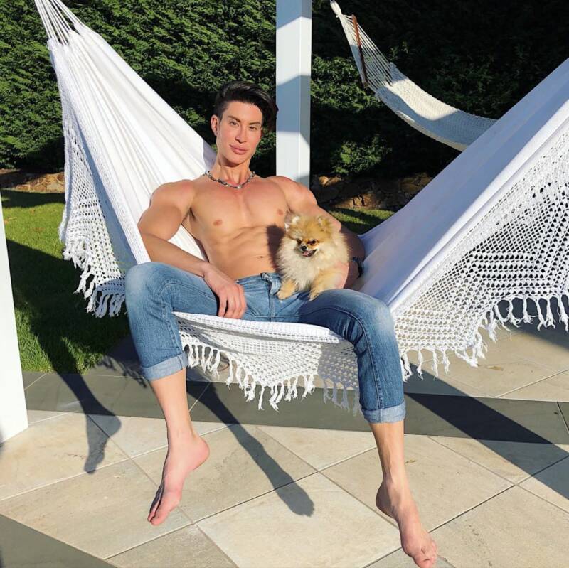 Justin Jedlica On Hammock With Dog