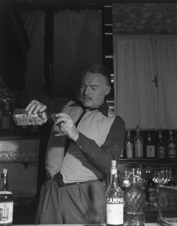 Ernest Hemingway Pouring A Drink