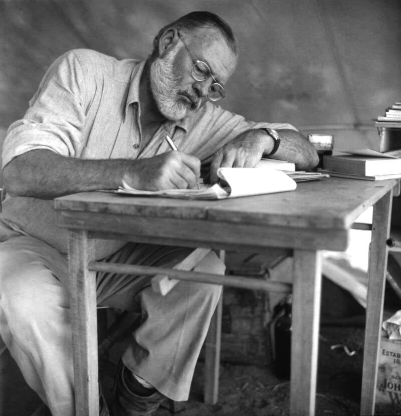 Ernest Hemingway Writing At A Desk
