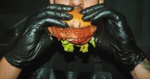 Man Eating Human Flesh Burger