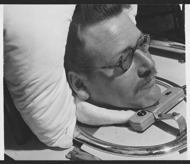 Man In Iron Lung Pressing A Button