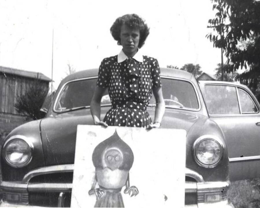 Kathleen May Holding A Drawing Of The Flatwoods Monster