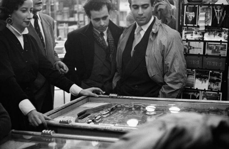 Pinball Players In A Parisian Cafe