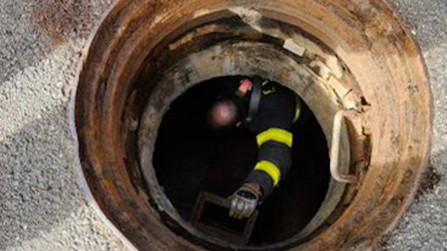 Firefighter Enters Sewer