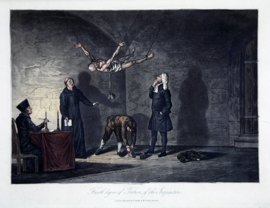 Spanish Inquisitors Torturing A Man