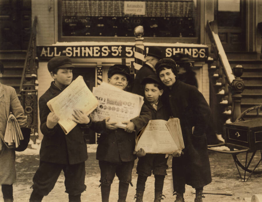 Four Newsboys With Papers