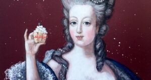 Marie Antoinette Holding A Cupcake