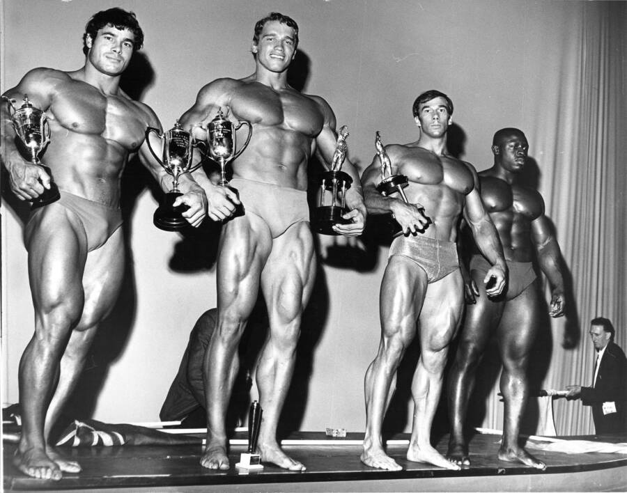 Arnold Schwarzenegger And Franco Columbu Holding Trophies