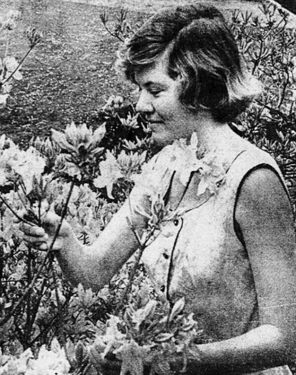 Juliet Hulme Smelling Flowers