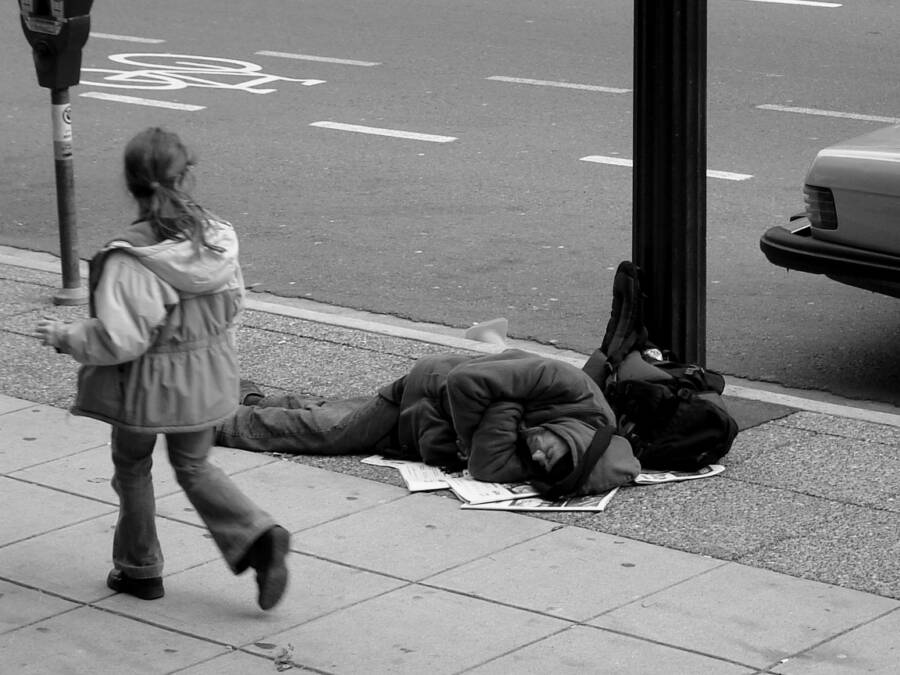 Man Sleeping On Sidewalk