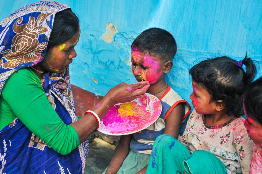 Woman Painting Child's Face