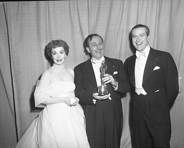 Walt Disney Holding An Oscar