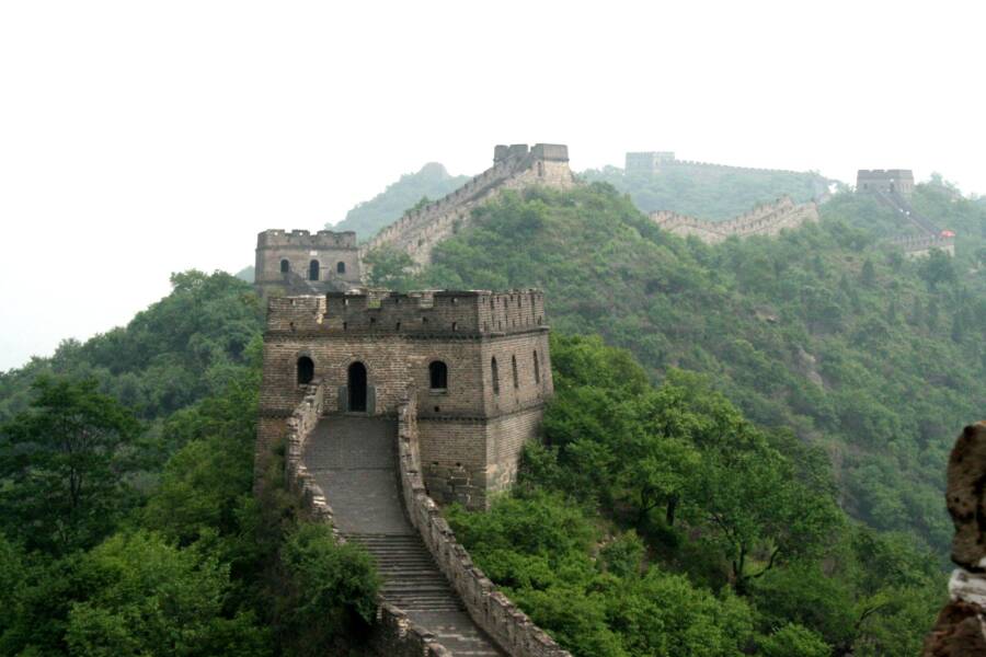 Great Wall of China damaged by workers with an excavator