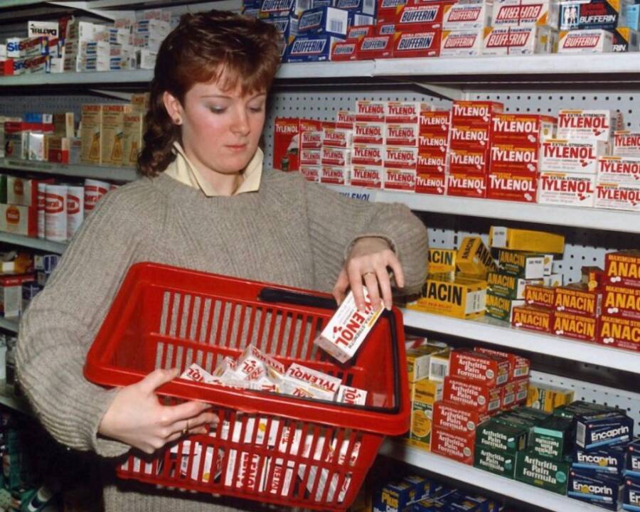 Employee Removing Tylenol From Store Shelves