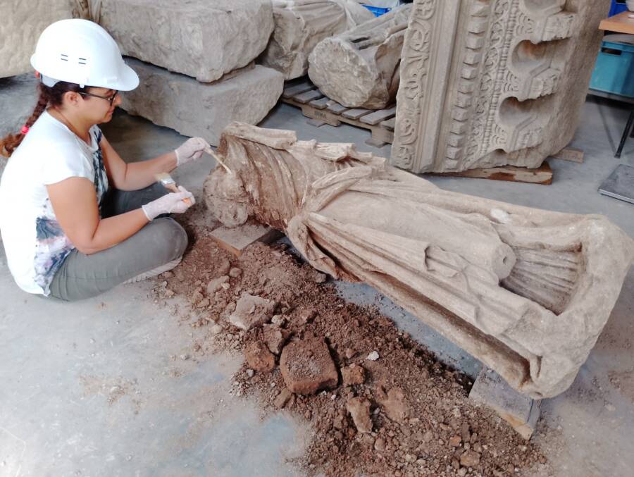 Archaeologists Cleaning Dancing Muses Statue