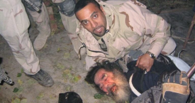 Soldier Capturing Saddam Hussein Featured