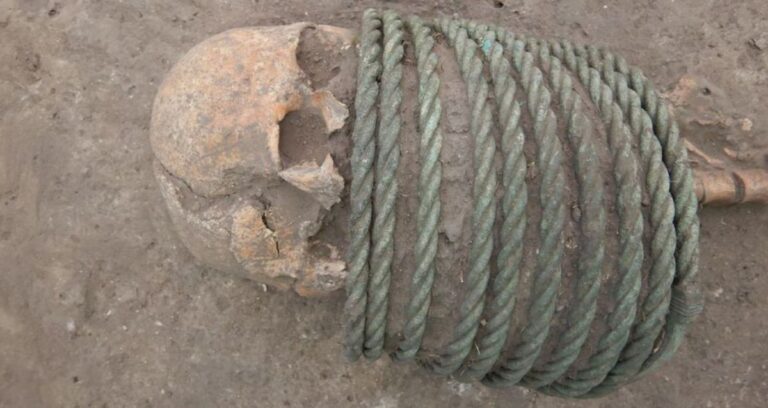 Skeleton With Bronze Neck Rings Featured