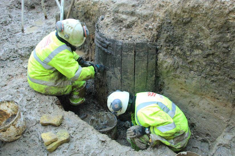 Archaeologists Excavating Timber Wells