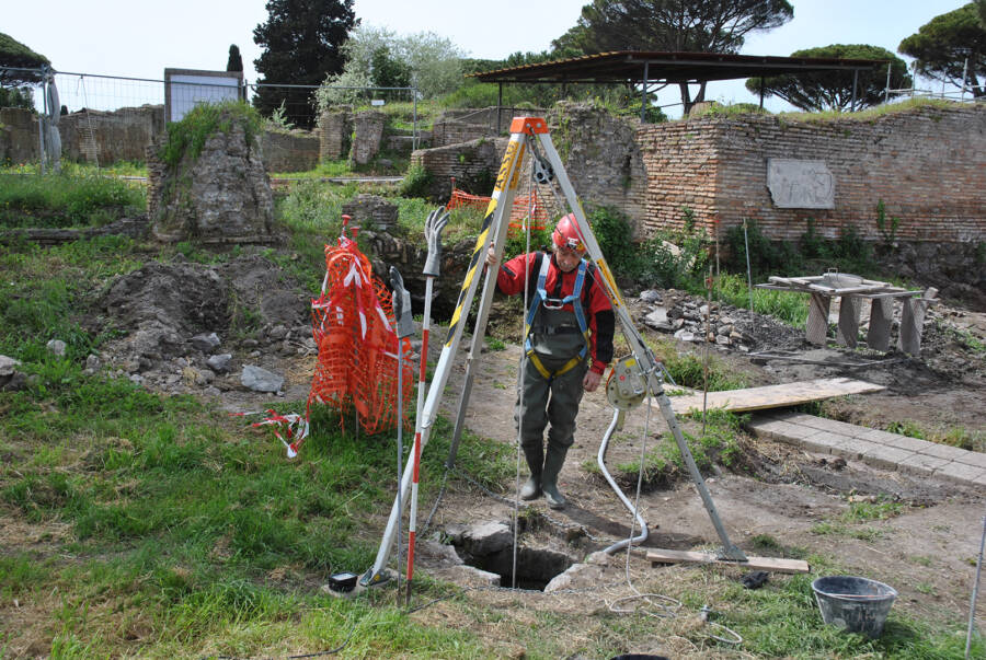 Archaeologist Diving Into The Well