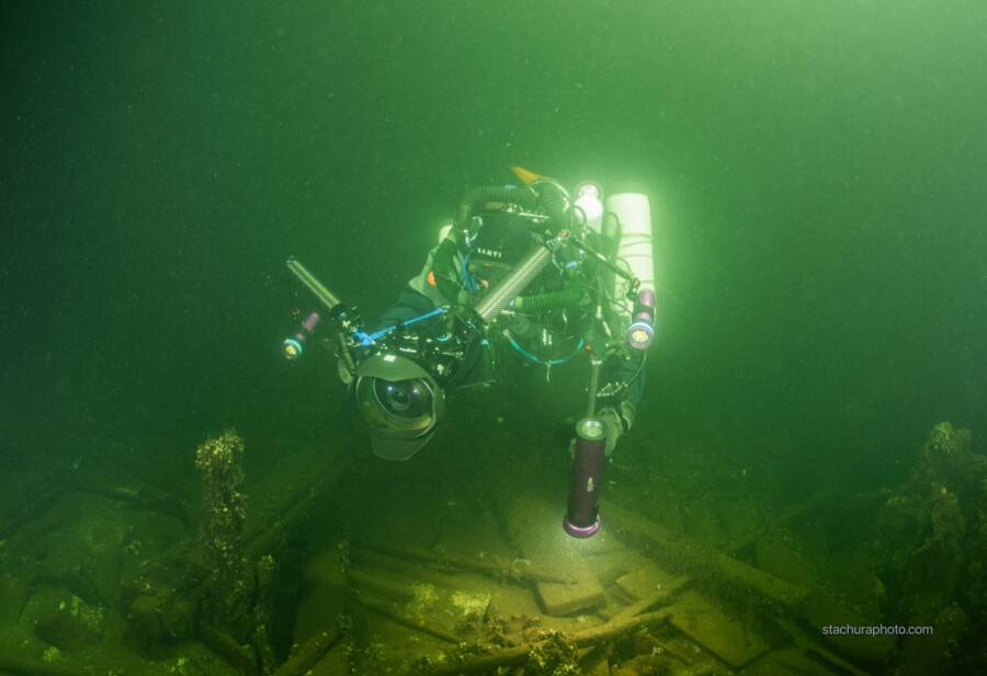 Diver Exploring Baltic Shipwreck Containing Champagne