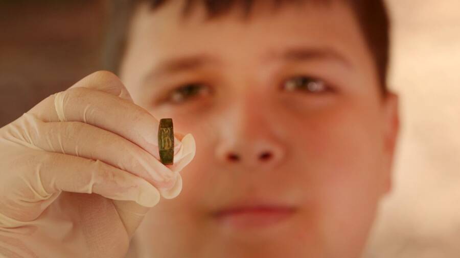 Teenager Holding The Minerva Ring