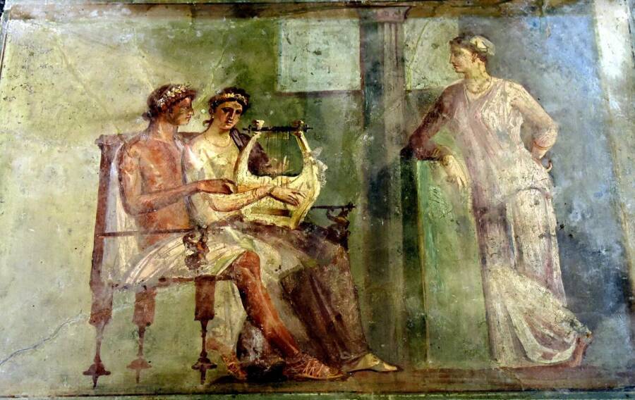 Woman Playing A Lyre