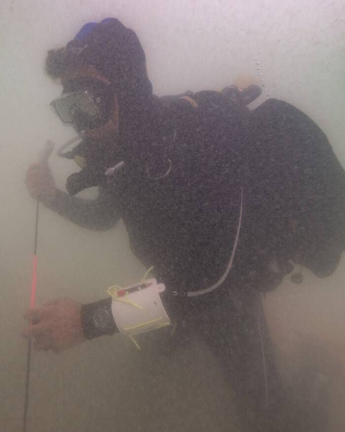 Divers At The Koning Willem De Tweede Shipwreck Site
