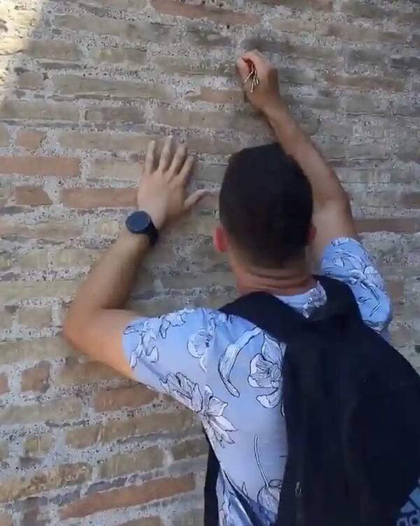 Tourist Carving Into Colosseum