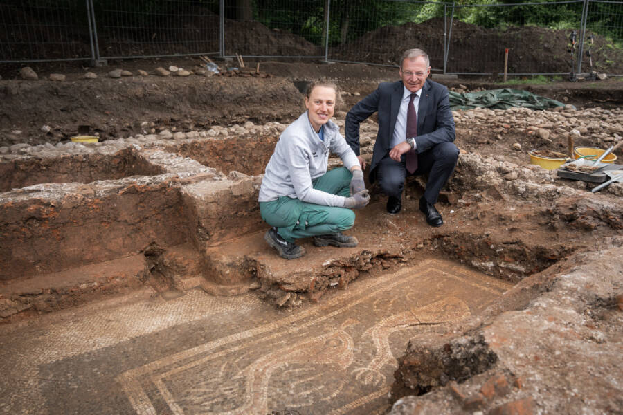 Archaeologists With Dolphin Mosaic