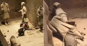 Chinese Tourist Alongside Damaged Terracotta Warriors Featured