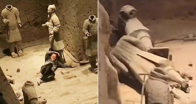 Chinese Tourist Alongside Damaged Terracotta Warriors Featured