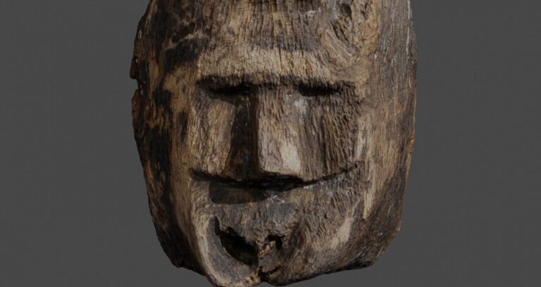 Face Carved From Wood Featured