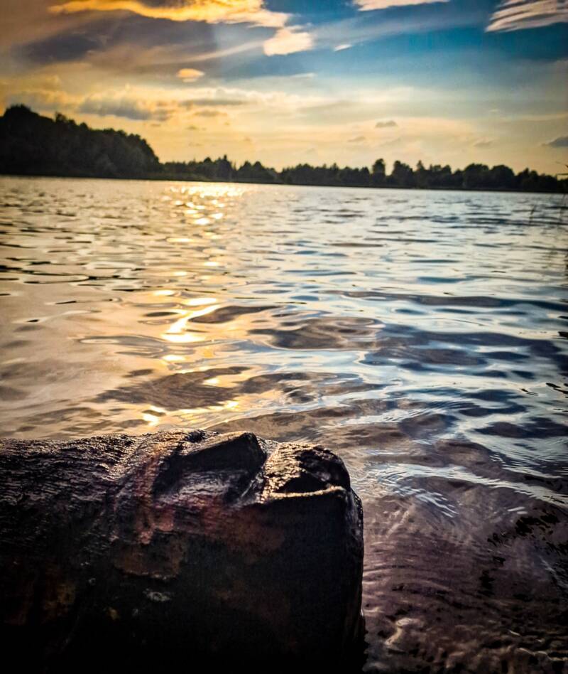 Face Carving On Shore Of Lake Lednica