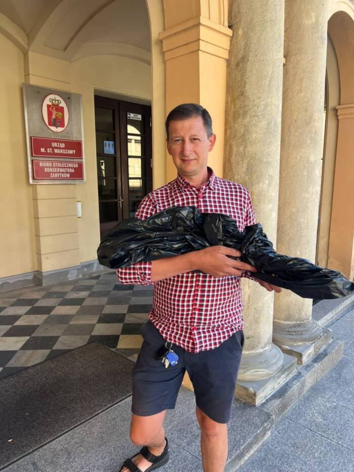 Andrzej Korpikiewicz Holding Medieval Sword