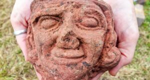 Carved Stone Head Featured