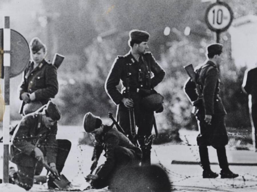 East German Soldiers Building Berlin Wall