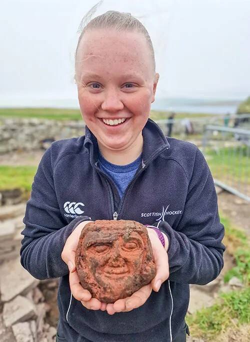 Katie Joss Holding Carved Head