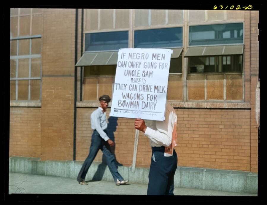 Black Man Protesting Outside A Milk Factory