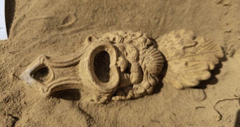 Roman Mask Oil Lamp Closeup Featured