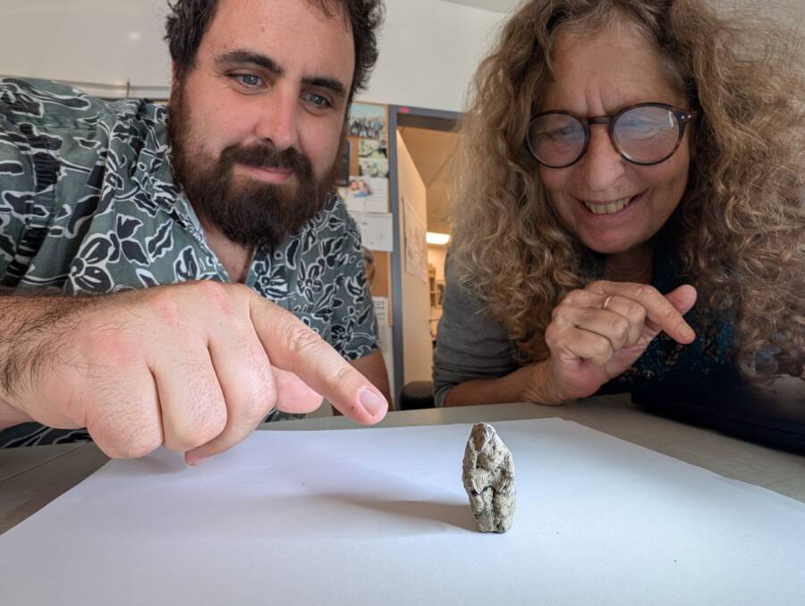 Researchers With The Goose Woman Figurine