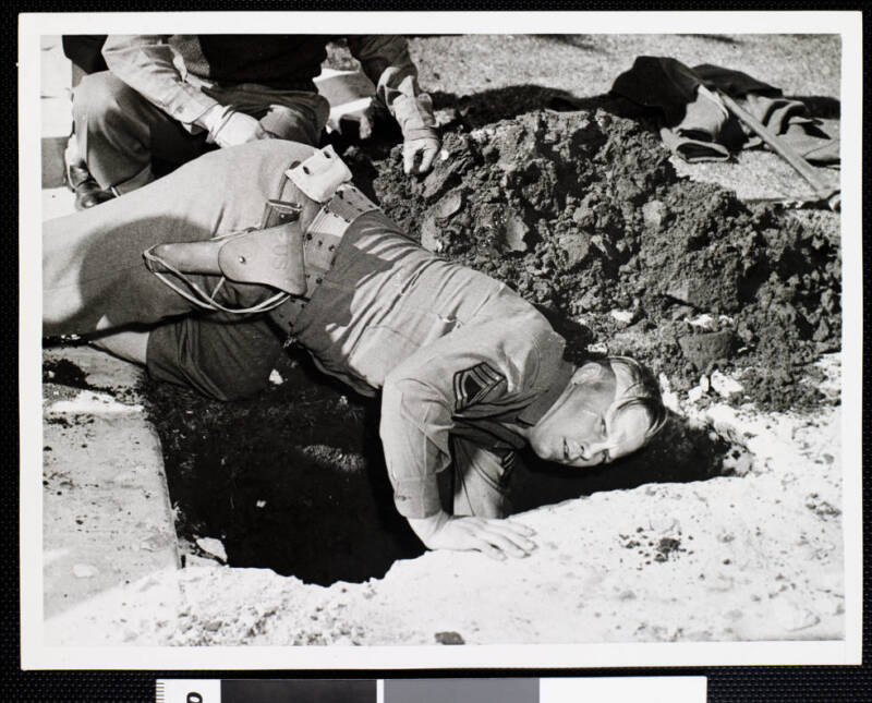 Army Officer Digging For A Shell In Los Angeles