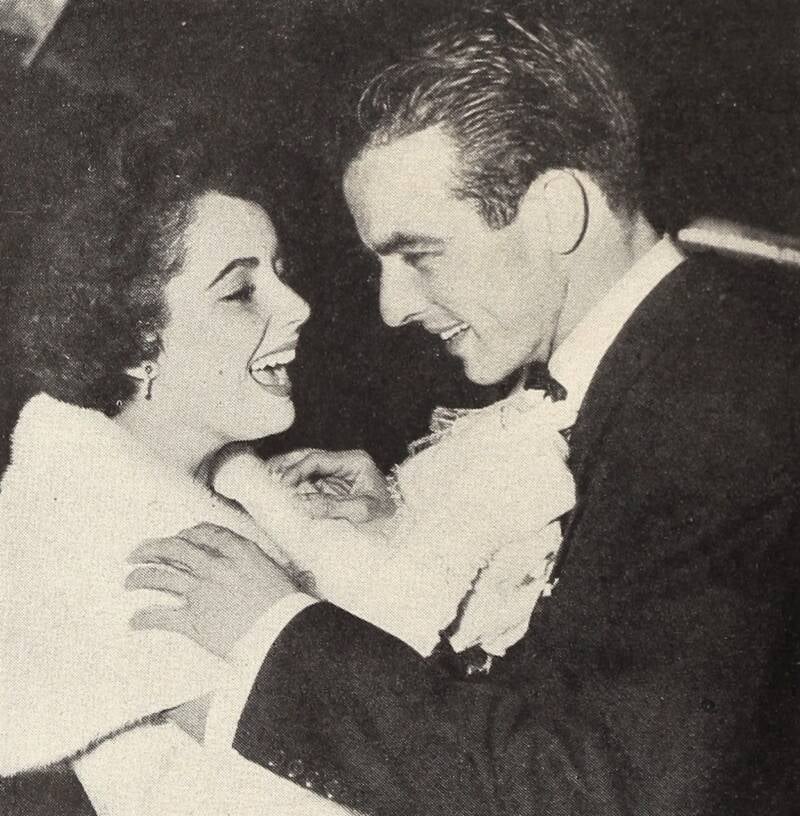 Elizabeth Taylor Fixing Montgomery Clift's Tie
