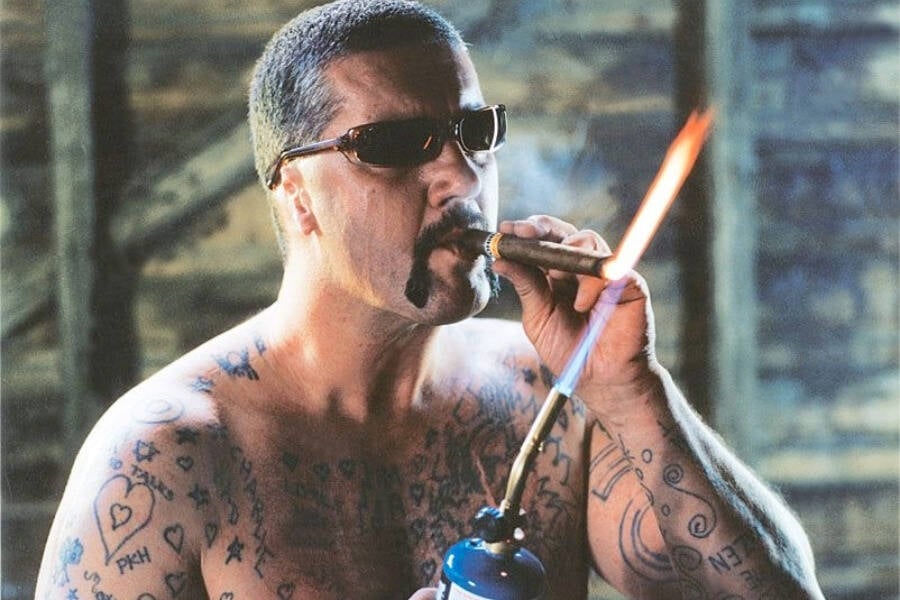 Lighting A Cigar With A Torch